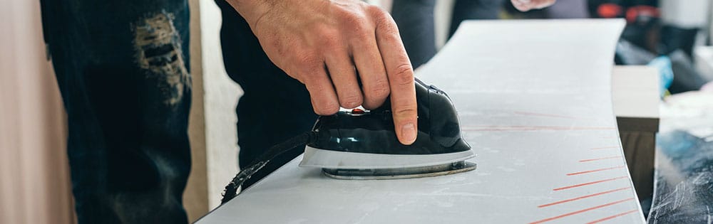 waxing snowboard