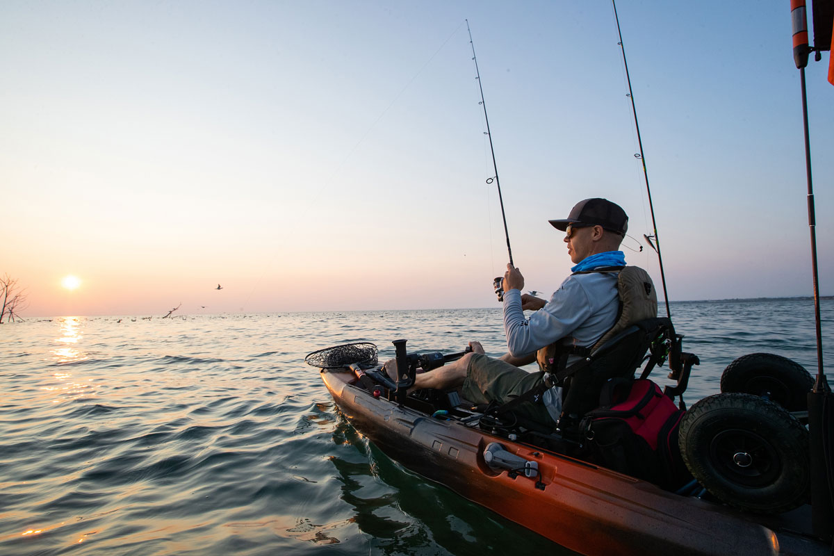 man fishing on boat